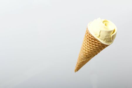 Waffle cone filled with marshmallows. Marshmallows in the form of a flower. Soars in the air. On a...