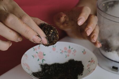 Shredded dried fruit sweets. Balls of prunes, dates and coconut. With a sprinkle of black sesame...