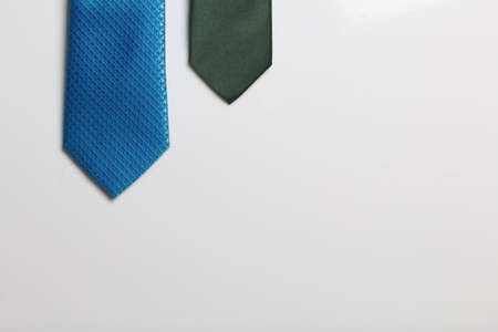 Two men's ties in different colors and sizes. For father and son. Love and Togetherness Objects. On a white backgroundの写真素材
