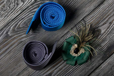 Two men's ties in different colors and sizes. Women's brooch. For father, mother and son. Love and...