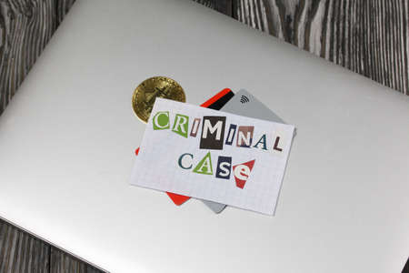 The phrase Criminal case made of letters cut from a magazine and pasted on a sheet of paper. The...