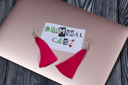 The phrase Criminal case made of letters cut from a magazine and pasted on a sheet of paper. The...