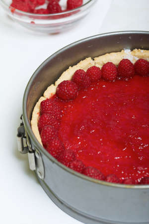 Raspberries on raspberry jelly. Levington cake, stages of preparation.