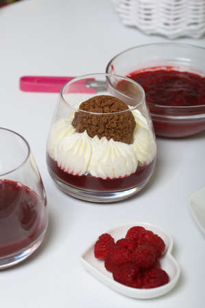 Cooking cream cheese dessert with raspberry jelly. The ingredients are laid out on the table...