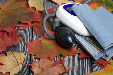 Tonometer for measuring blood pressure. Among the autumn maple leaves.の写真素材