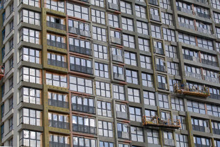 Construction of modern multi-storey buildings. New development of a residential area. House frames...