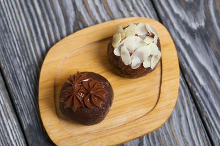 Potato cake. Decorated with almond petals and chocolate cream.の写真素材