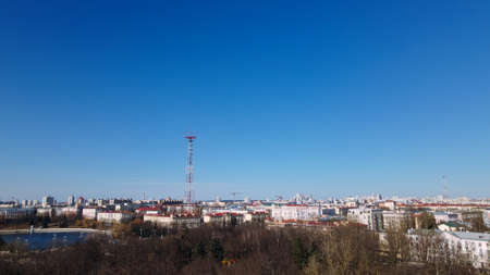 Aerial view of the cityscape. High-rise buildings on the horizon. There is a TV tower among the...