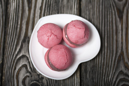 Lavender macaroni cake with white chocolate and blueberries. Lies on pine boards.の写真素材