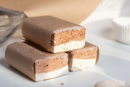 Portion marshmallow with cocoa and cranberries. Wrapped in paper and tied with string. Two-layer...