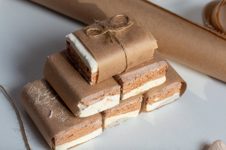 Portion marshmallow with cocoa and cranberries. Wrapped in paper and tied with string. Two-layer zephyr.の写真素材