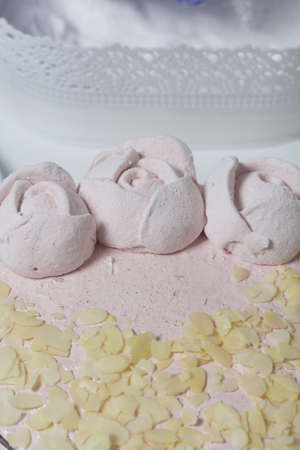 Marshmallow cake. Layers of biscuit, marshmallow and jelly. Decorated with marshmallow roses and...