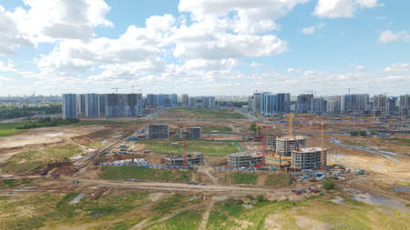 Modern urban development. Construction site with multi-storey buildings under construction....