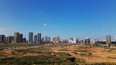Modern urban development. Construction site with multi-storey buildings under construction. Construction of a new city block. Aerial photography.の写真素材