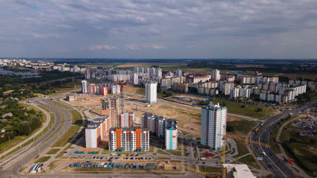 Construction site for a new city block. New houses have been built. Aerial photography.