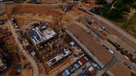 Construction site for a new city block. New houses have been built. Aerial photography.