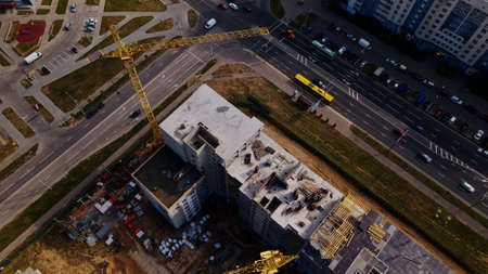 Construction site for a new city block. New houses have been built. Aerial photography.