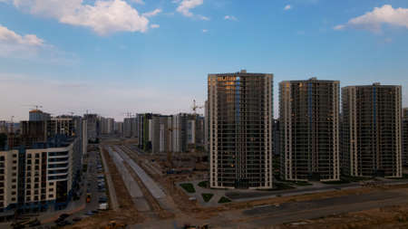 City block. Multi-storey buildings. City landscape at sunrise. Aerial photography.