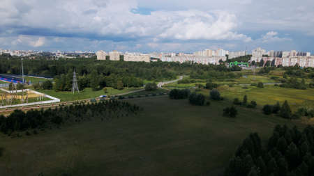 Urban development and city park. Shot at dawn, at sunrise. Aerial photography.