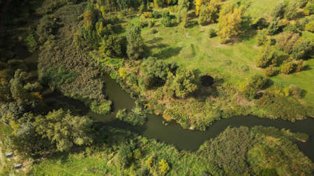 Park area. A winding river with water lilies. Swampy area. Aerial photography.の写真素材