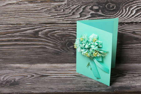 Homemade handmade postcard. On black pine boards.の写真素材