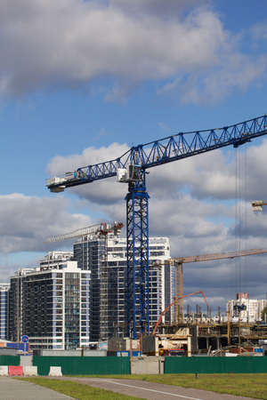 Construction of modern multi-storey buildings. Construction of a new city block. Buildings under construction and tower cranes.の写真素材