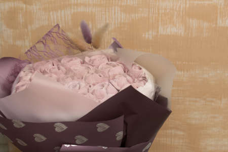 Marshmallow bouquet packed in craft paper. Zephyr rose flowers.の写真素材