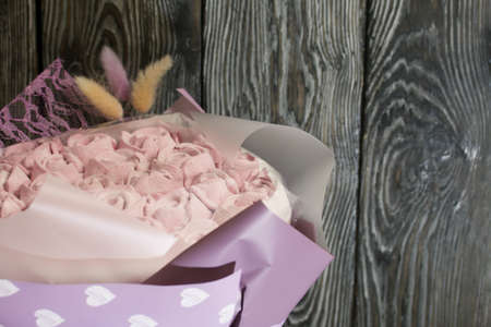 Marshmallow bouquet packed in craft paper. Zephyr rose flowers.の写真素材