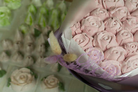 Marshmallow bouquet packed in craft paper. Zephyr rose flowers.の写真素材