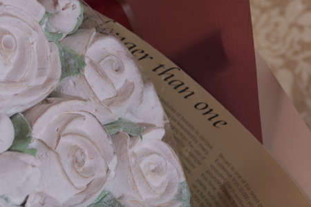 Marshmallow bouquet packed in craft paper. Zephyr rose flowers. Close-up shot.の写真素材