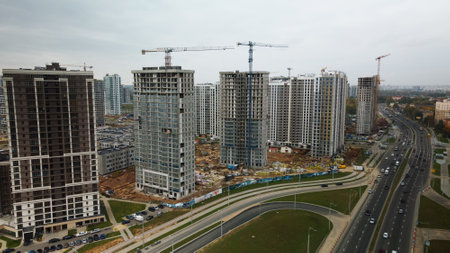 Construction of modern multi-storey buildings. Construction of a new city block. Buildings under...