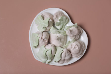 Marshmallow in the form of roses and tulips. Close-up shot.の写真素材