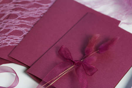 Making greeting cards. Paper blanks, ribbons and lagurus branches. Are laid out on the table...