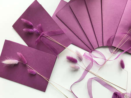 Making greeting cards. Paper blanks, ribbons and lagurus branches. Are laid out on the table...