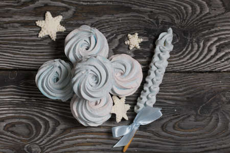 Marshmallow blue and pink. zephyr on a stick. Decorated with mastic snowflakes.の写真素材