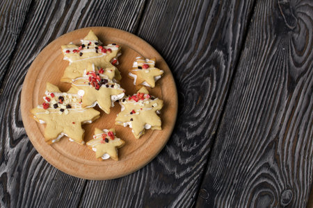 Marshmallow sandwiches decorated with chocolate and freeze-dried strawberries. Lie on a round wooden board. Close-up shot.の写真素材