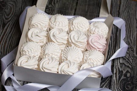 Homemade marshmallow in a gift box. Zephyr in the form of roses. Close-up shot.の写真素材