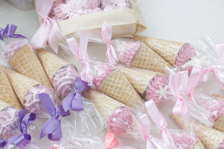Zephyr in waffle cones. Decorated with decorative sprinkles and mastic snowflakes. close-up.