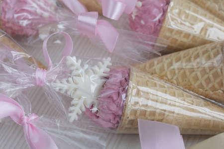 Zephyr in waffle cones. Decorated with decorative sprinkles and mastic snowflakes. close-up.