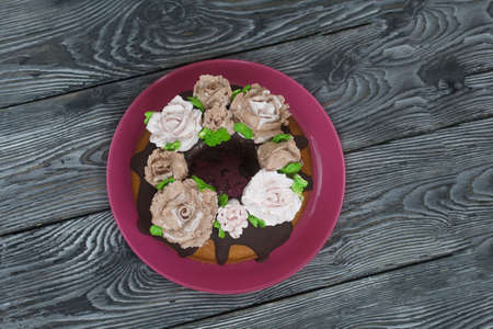 Marble cake with chocolate and marshmallow roses. close-up.の写真素材
