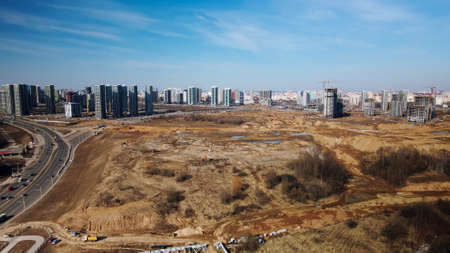 Construction of a modern city block Multi-storey buildings made of glass and concrete. Photographed in cloudy weather. Aerial photography.の写真素材