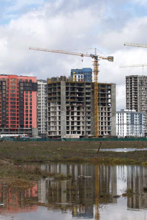 Construction of multi-storey buildings. Modern multi-storey building. Houses with reinforced...