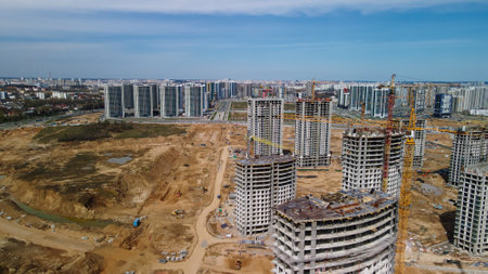 Large construction site. Construction of modern multi-storey residential buildings. Construction of apartment buildings from concrete and glass. aerial photography.の写真素材