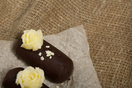 Cake potatoes. Decorated with butter cream. On a line background. Shot close-up.