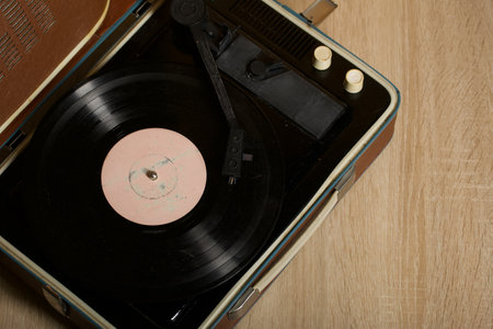 Vintage vinyl record player. The vinyl record is spinning. close-up.