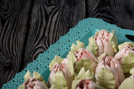 Zephyr tulips. Natural homemade marshmallow. Arranged on a tray. close-up.の写真素材
