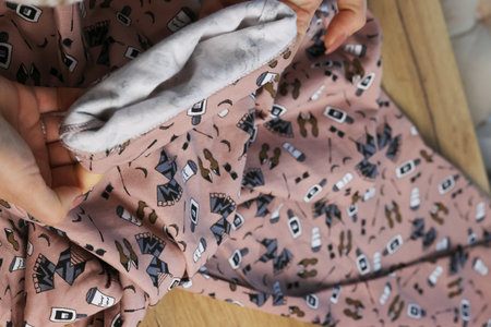 A woman is reviewing a cozy insulated home pajama. Photo from above.