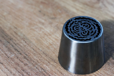 Tip for making marshmallow tulips. Pastry tip made of metal. Close-up view.の写真素材