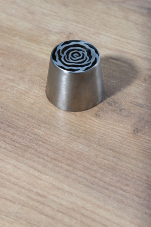 Tip for making marshmallow tulips. Pastry tip made of metal. Close-up view.の写真素材