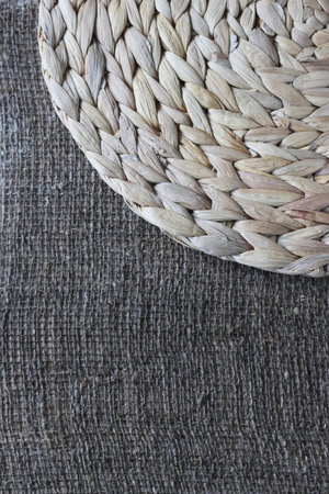 One placemat made of water hyacinth on rough linen burlap.